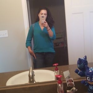 Teal blouse with convertible sleeves